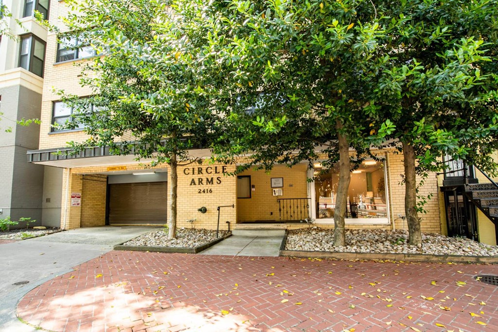 circle arms front of building