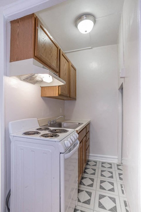 a small kitchen with a stove and a sink