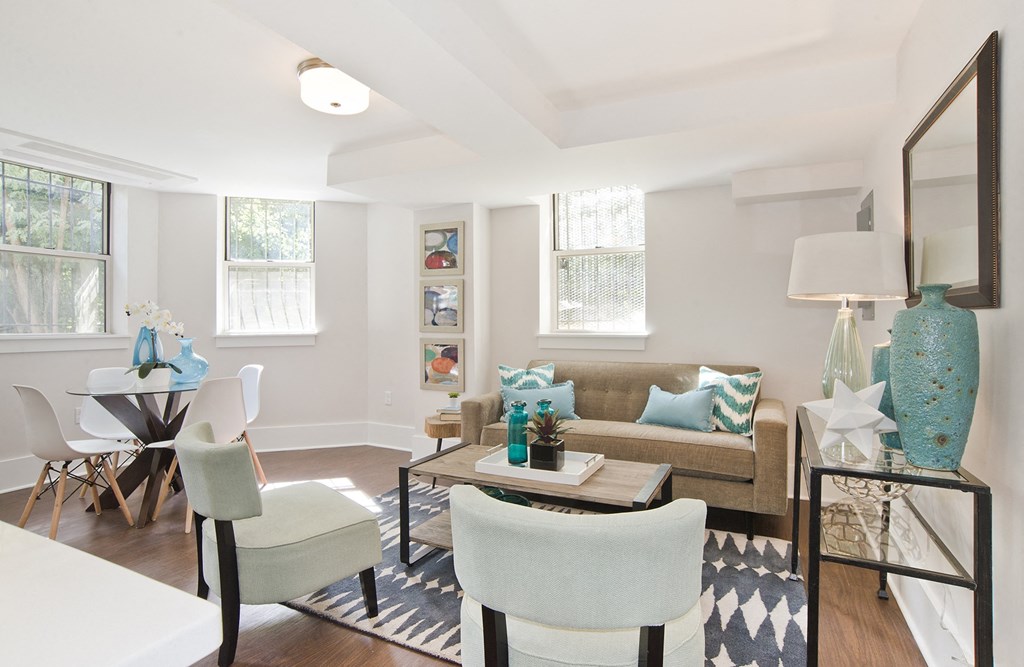 living room with a couch and chairs