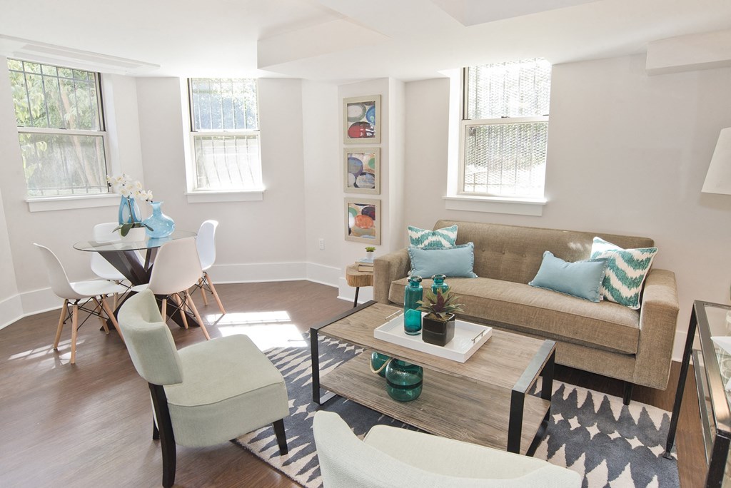 living room with a couch and chairs and a table
