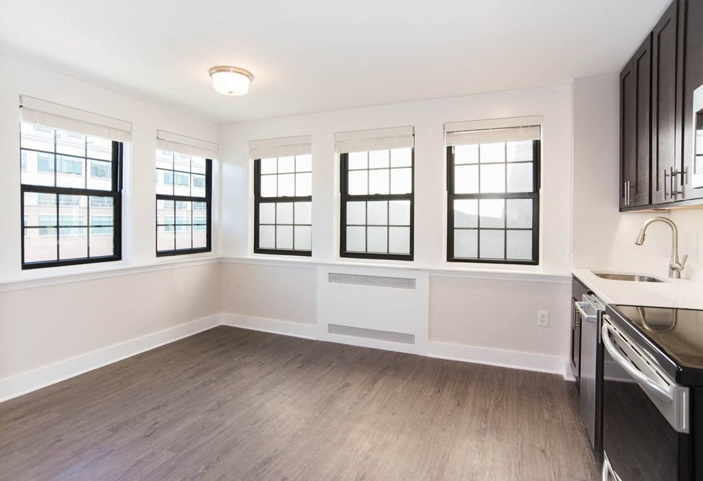 an empty kitchen with a sink and a window