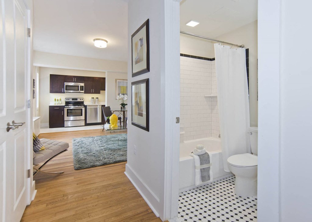 a bathroom with a shower and a toilet in a room