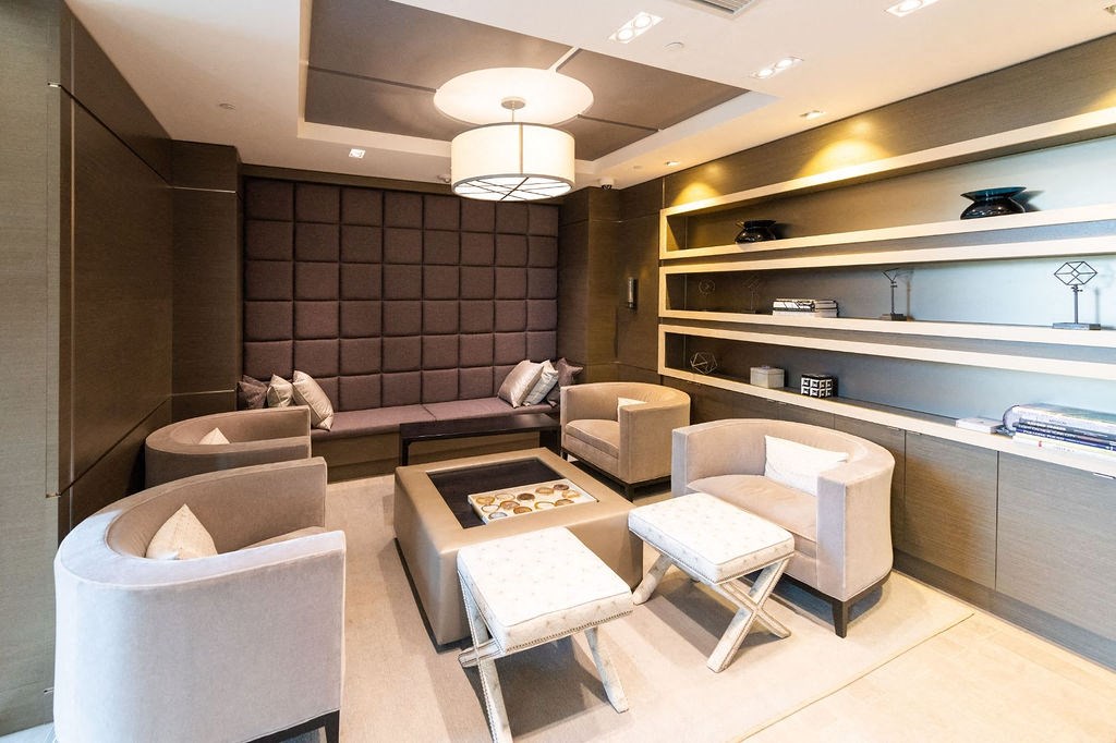 a living room with couches and chairs and a table