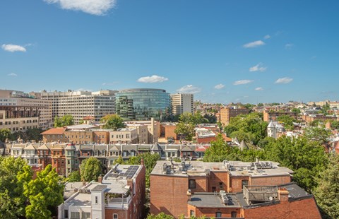 an aerial view of a city with buildings and trees