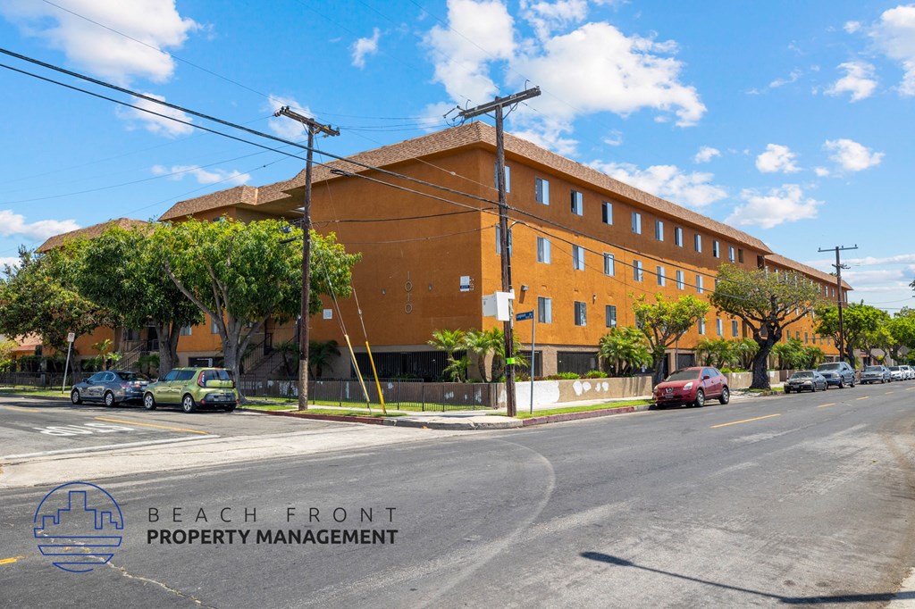 a large brick building on the corner of a street