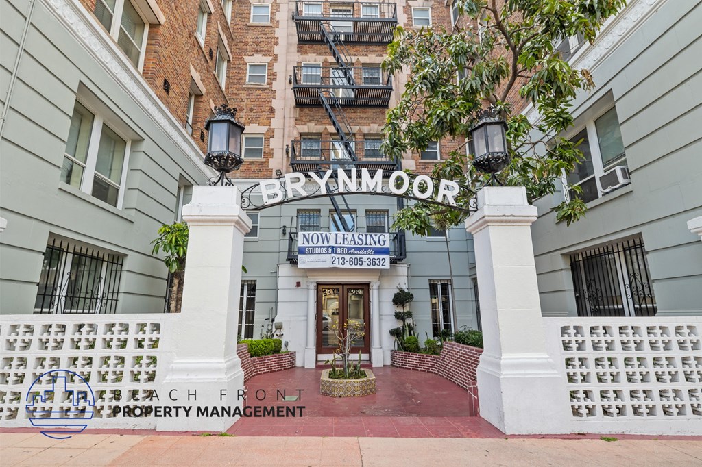 The front of the Brynmoor Hotel with a sign that says "Now Leasing".