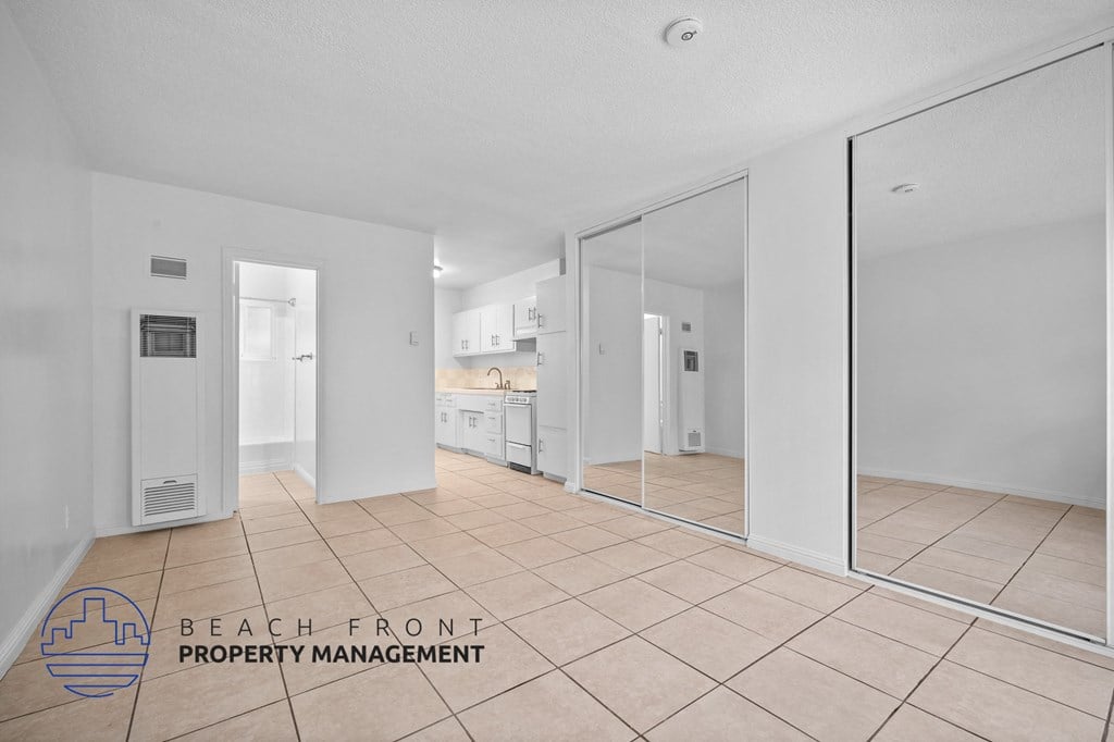a view of the living room and kitchen of this beachfront property