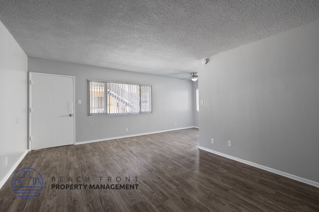 the living room and dining room of an apartment