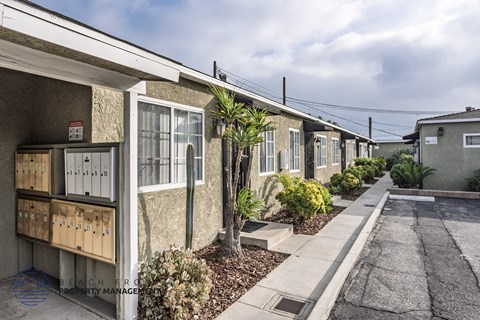 A row of houses with a sign that says