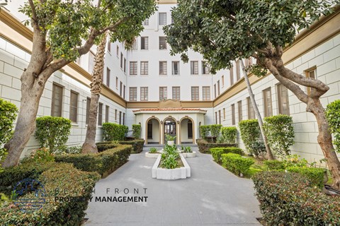 A building with a sign that says Front Management.