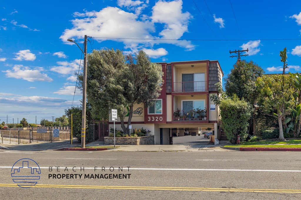 A two-story building with a balcony is located on Beach Front property.
