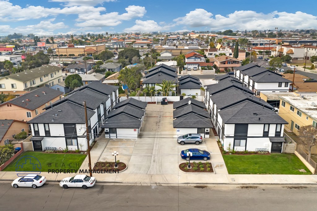 an aerial view of a neighborhood with houses and cars
