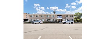 a building with a parking lot in front of it