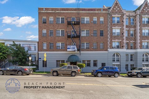 A building with the words Beach Front Property Management on the bottom left corner.