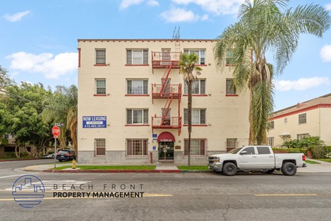 A white building with a sign that says