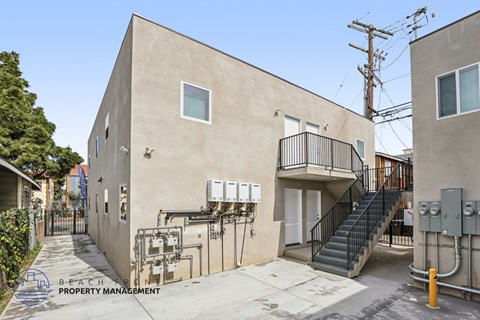 A building with a staircase leading to the second floor.