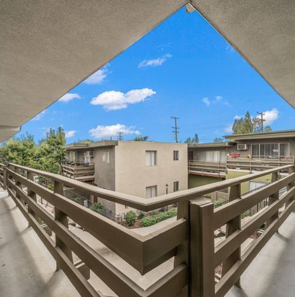the view from the balcony of an apartment building