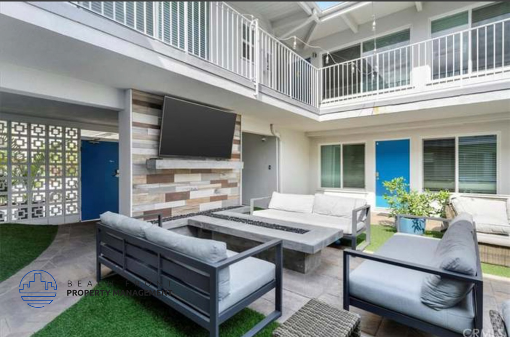 a spacious living room with couches and a television