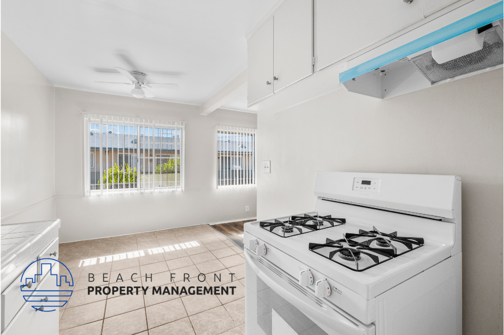 an image of a kitchen with white appliances and a stove