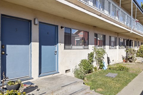 A building with blue doors numbered 4 and 5.