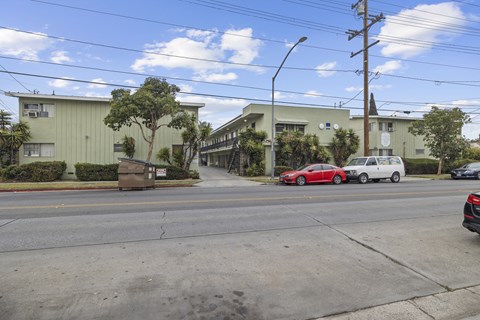 A street view with cars and buildings.