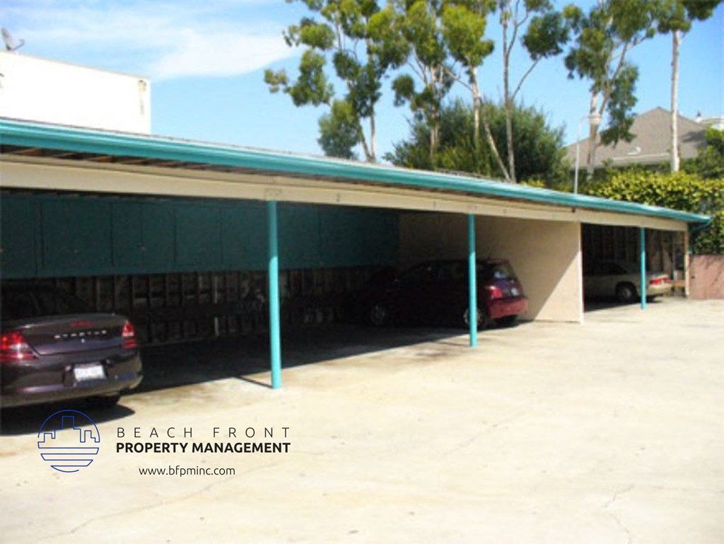 a covered parking garage with cars in it