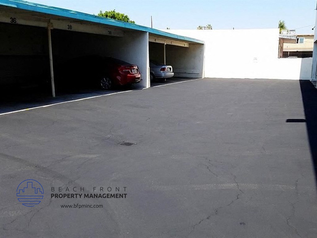 a parking garage with two cars parked in it