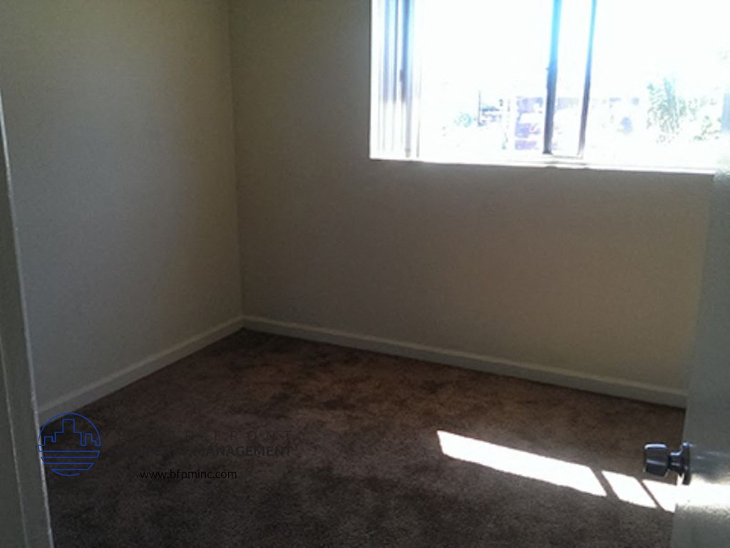 an empty room with a window in it