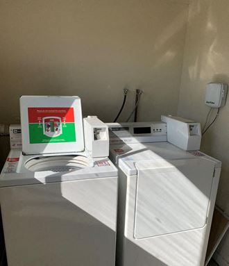 a laptop computer sitting on top of a refrigerator