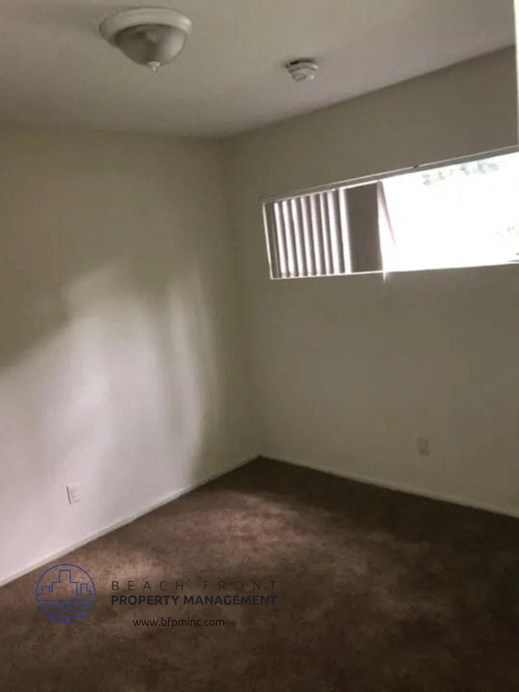 an empty room with a window in it
