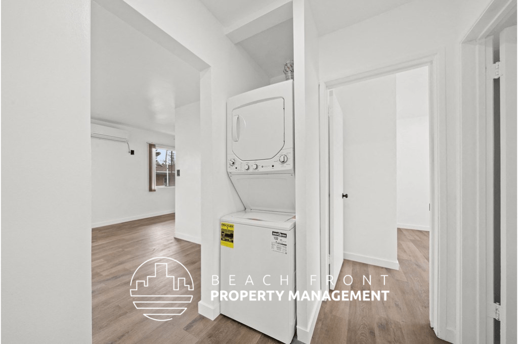 a room with a washing machine and a dryer in it