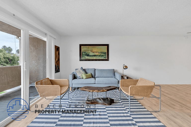 a living room with a couch and chairs and a rug