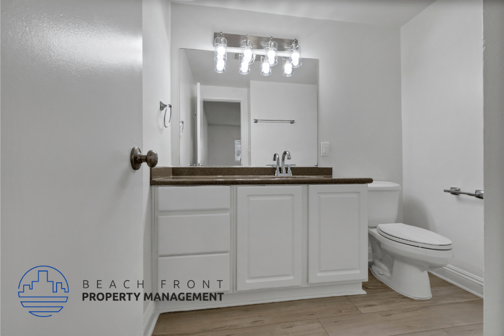 a bathroom with a sink and a toilet and a mirror