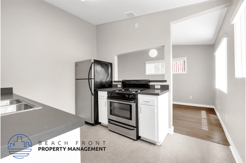 a kitchen with stainless steel appliances and a stove and refrigerator