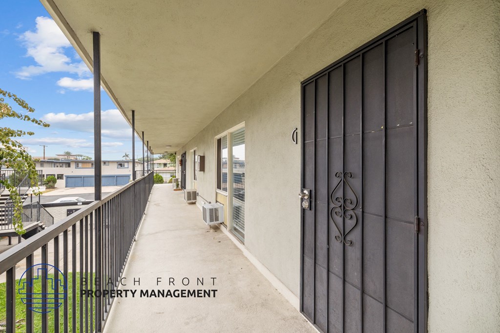 the doors to the apartment balconies are open to the exterior of the building