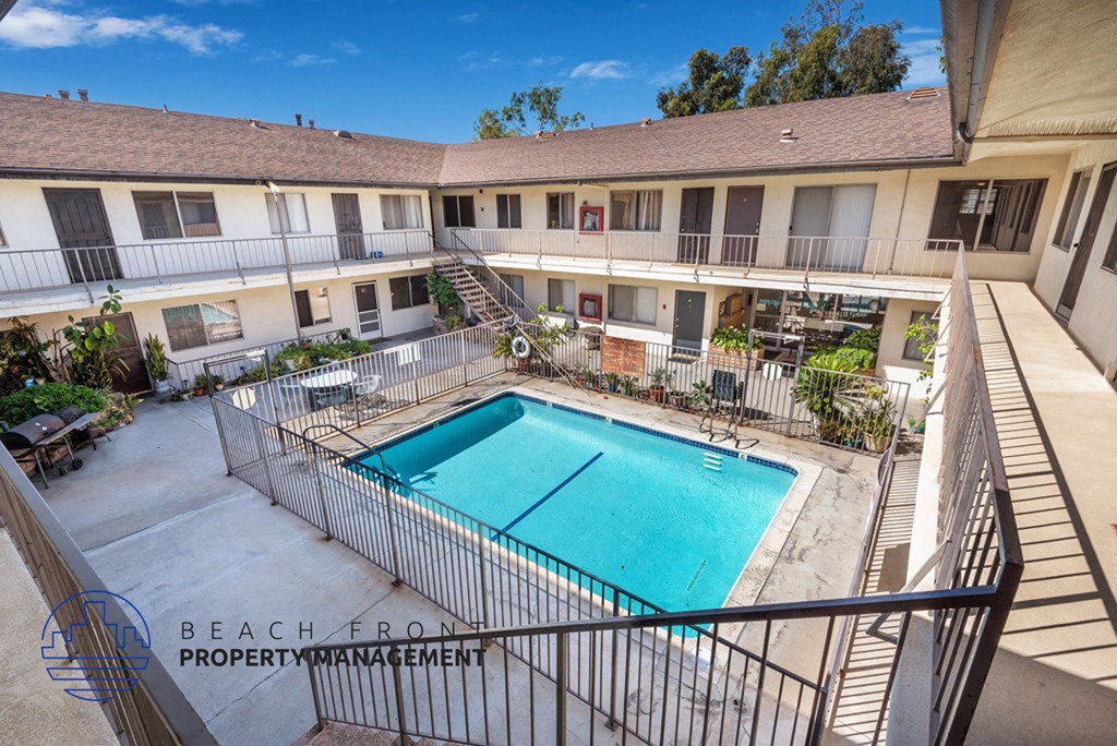 a view of the pool of a building with a swimming pool