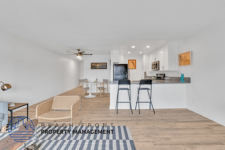 the living room and kitchen are open to the dining area and living room with a