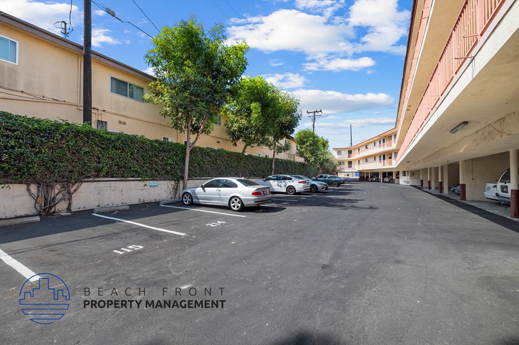 A parking lot with a car parked in the 15 spot.