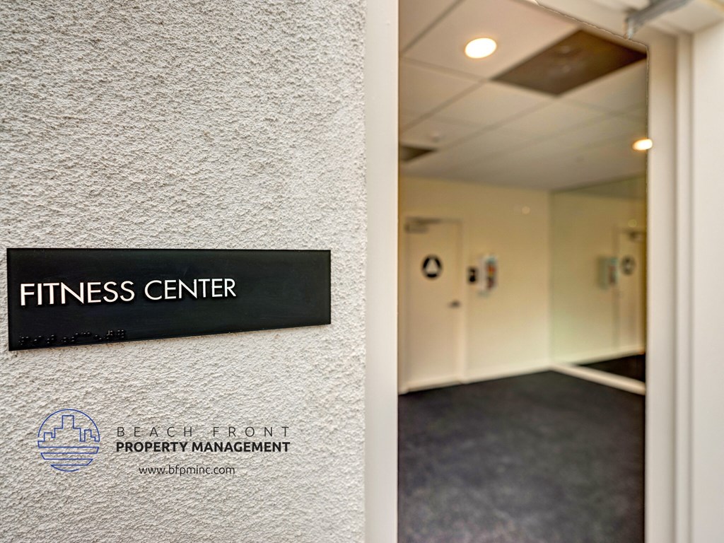 the entrance to the fitness center at the beach front property management office in the fitness
