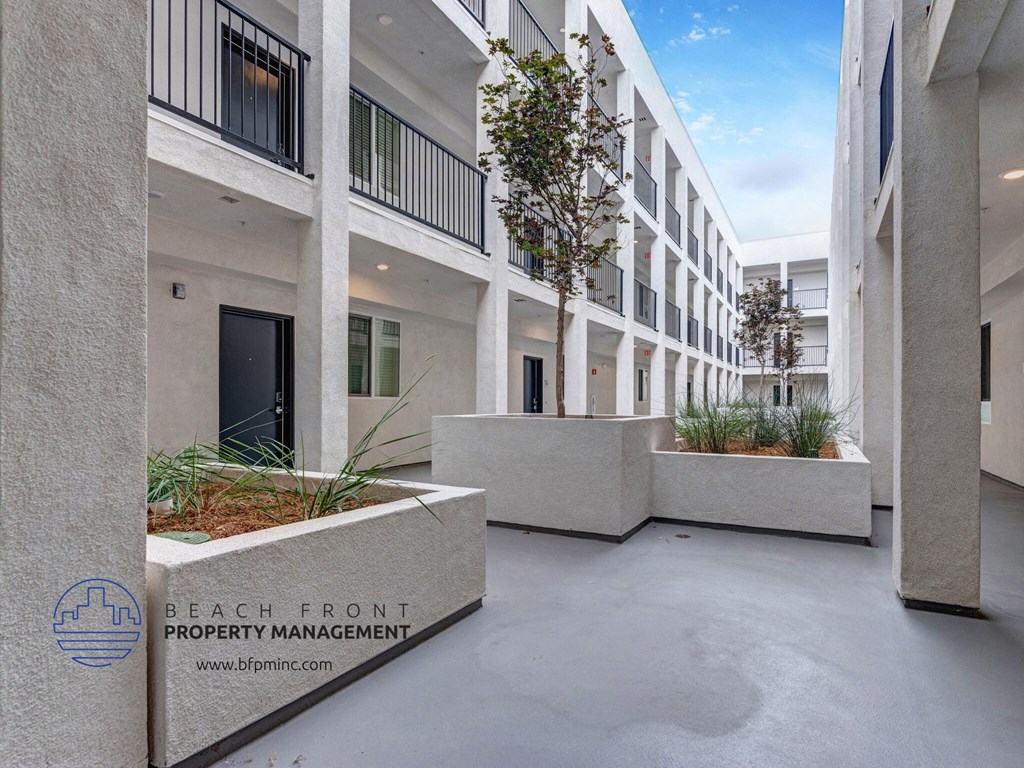 the entrance to the beach front property management building at the pier