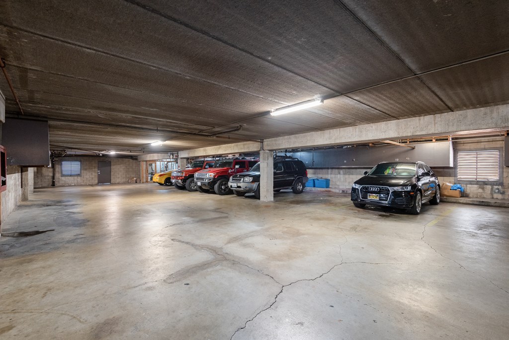 a parking garage with cars parked in it