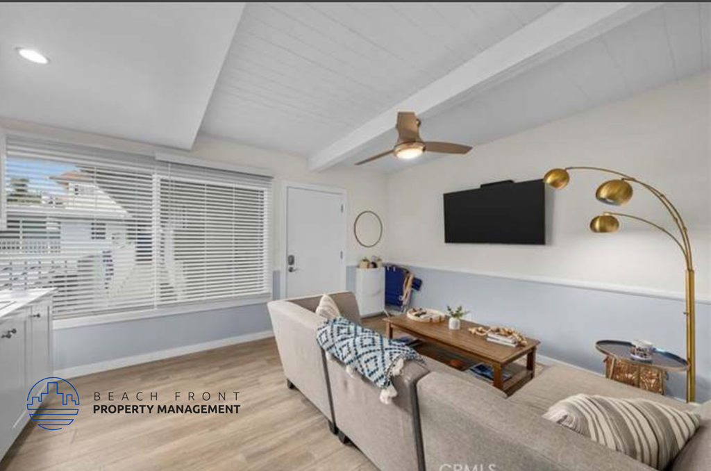 a living room with a couch and a tv