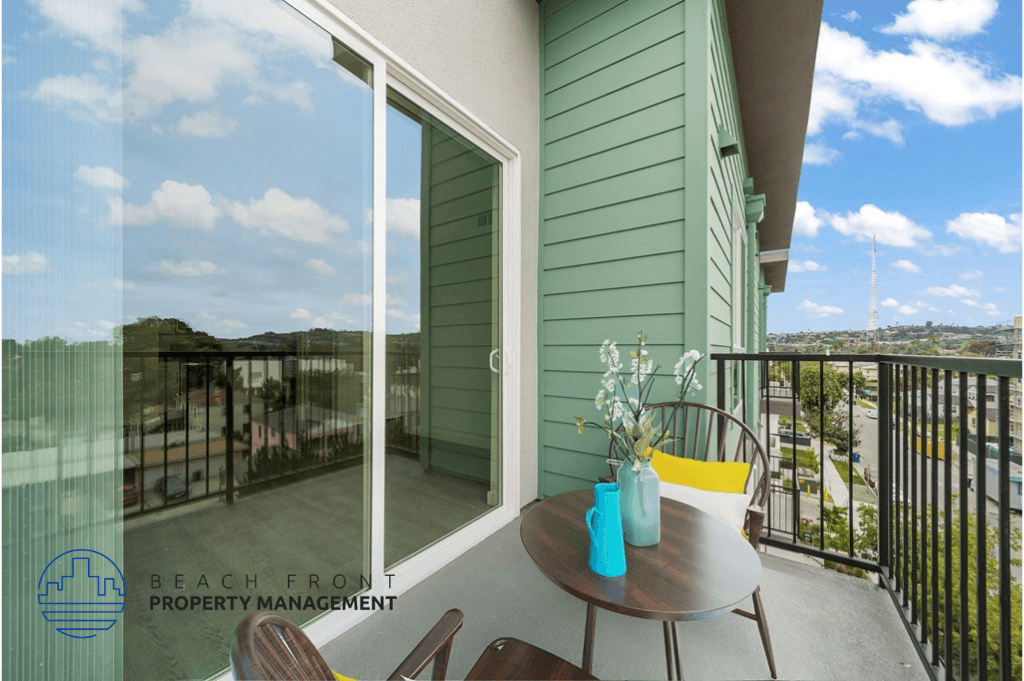 a balcony with a table and chairs and a sliding glass door