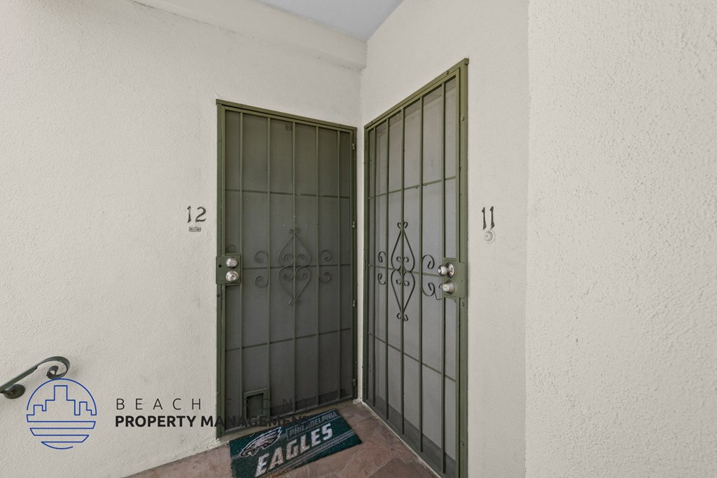 the door to the entrance of a building with metal doors