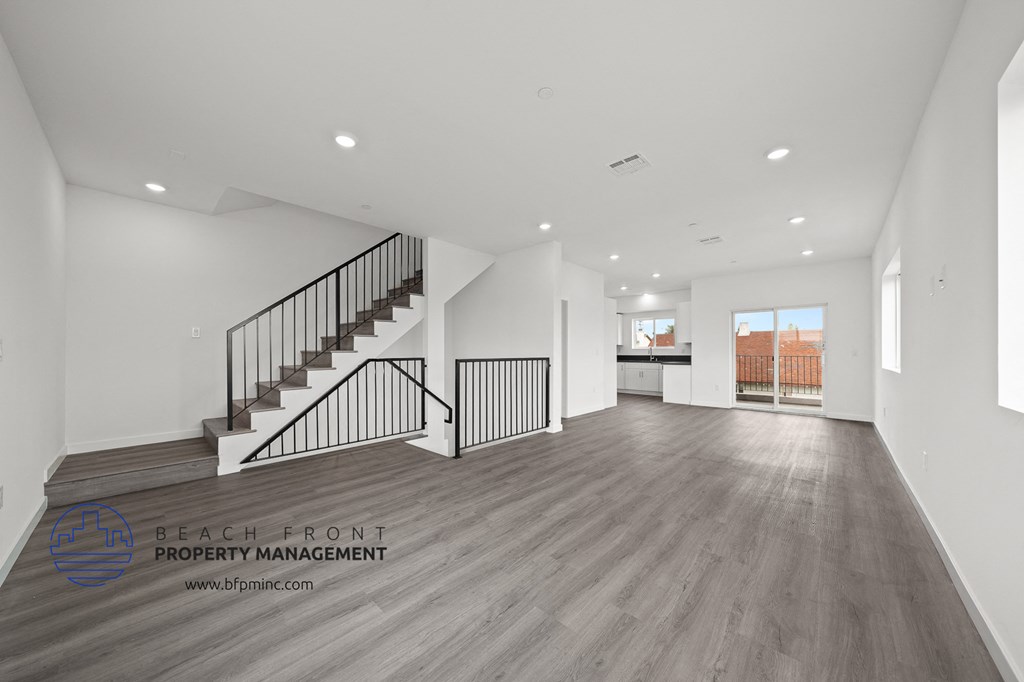 a view of a living room and staircase in a new home
