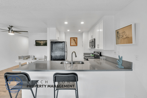 a kitchen with a counter top and a sink
