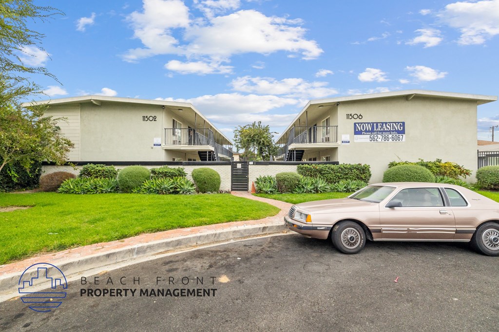 a car parked in front of an apartment building