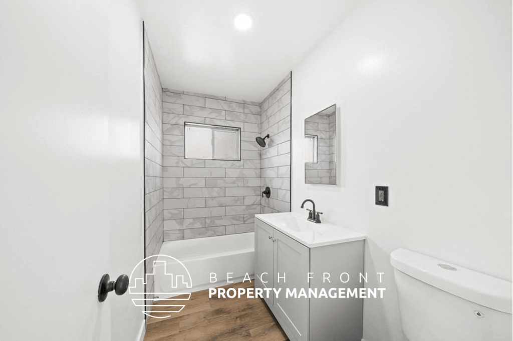 a bathroom with a sink and a toilet and a shower