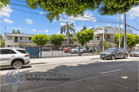a city street with cars parked on the side of the road