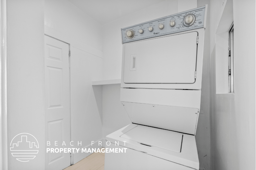 a white kitchen with a white stove and a white refrigerator